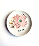 porcelain ring dish with pink dogwood stamped, with personalized name stamped in black