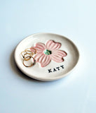 porcelain ring dish with pink dogwood stamped, with personalized name stamped in black