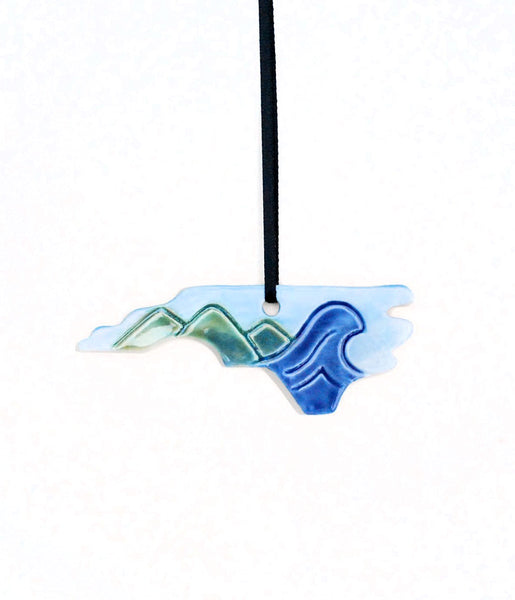Mountain to the Sea State Ornament - Made to OrderA one-of-a-kind handmade ceramic ornament. All states, countries, provinces, islands are available. This handmade ceramic ornament is perfect for mountain and ocean