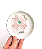 porcelain ring dish with pink dogwood stamped, and "mom" in black