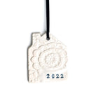 house shaped ornament, in white, with lace imprint, handstamped with year in black ink