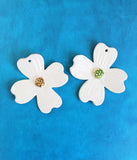 Two dogwood shaped ornaments, in white 