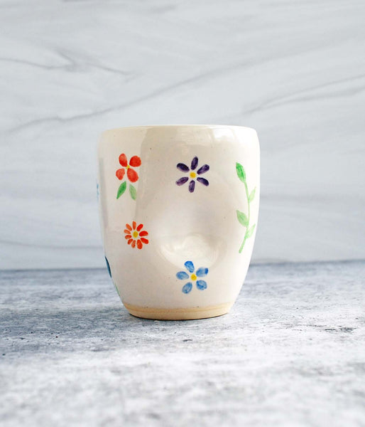 Ceramic Tumbler with small hand-painted flowers in orange, purple, blue, red, and yellow