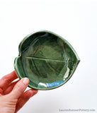 Green Leaf Bowl - SmallThis little green leaf bowl is handmade with a cream-colored clay, and is glazed with a green glaze. This bowl is perfect as a soap dish, spoon rest, jewelry dish or