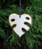 Monstera Leaf OrnamentMonstera leaf ornament, in the shape of the leaf. Add metallic gold luster for a special shine on your tree. This ornament can also be customized with a year, date o