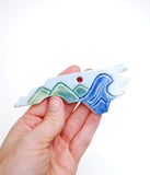 Mountain to the Sea State Ornament - Made to OrderA one-of-a-kind handmade ceramic ornament. All states, countries, provinces, islands are available. This handmade ceramic ornament is perfect for mountain and ocean 