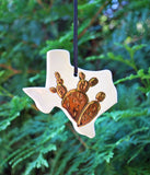 State Cactus Ornament - Made to OrderA one-of-a-kind handmade ceramic ornament, with a hand-carved cactus design, covered in 22k gold luster. All states available, and you can choose between two cactus 