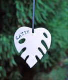 Monstera Leaf OrnamentMonstera leaf ornament, in the shape of the leaf. Add metallic gold luster for a special shine on your tree. This ornament can also be customized with a year, date o